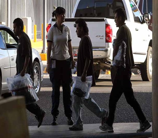 NOGALES, AZ - JUNE 02: A Mexican official takes custody at the border of Mexican's being returned to Mexico after being apprehended for entering the United States illegally June 2, 2010 in Nogales, Arizona. During the 2009 fiscal year 540,865 undocumented immigrants were apprehended entering the United States illegally along the Mexican border, 241,000 of those were captured in the 262 mile stretch of the border known as the Tucson Sector. (Photo by Scott Olson/Getty Images)