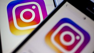 In this June 17, 2016, file photo, Facebook Inc.'s Instagram logo is displayed on the Instagram application on an Apple Inc. iPhone in this arranged photograph taken in Washington, D.C.