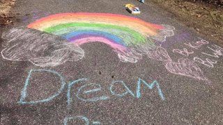 Photos of chalk messages on driveways