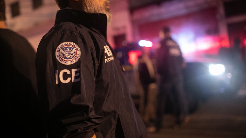 GUATEMALA CITY, GUATEMALA – MAY 29: An ICE agent with U.S. Homeland Security Investigations (HSI), watches as Guatemalan police investigate the scene after detaining a suspected human trafficker on May 29, 2019 in Guatemala City. Homeland Security agents accompanied Guatemalan police on an early morning raid, the first since Acting U.S. Homeland Security Secretary Kevin McAleenan signed an agreement with his Guatemalan counterparts, increasing cooperation on human and drug smuggling. McAleenan is on a four-day trip to Guatemala. (Photo by John Moore/Getty Images)