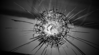 tlmd_bullet_hole_car_shutterstock_174765326