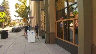 People enter a gym in San Mateo County.