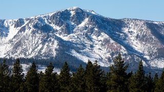 Snow dusts the mountains surrounding South Lake Tahoe.