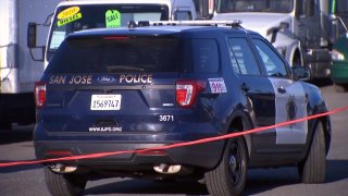 A San Jose police car at the scene of a deadly collision involving a juvenile.