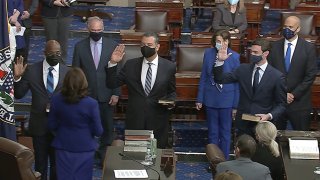 In this image from video, Vice President Kamala Harris swears in Sen. Raphael Warnock, D-Ga., Sen. Alex Padilla, D-Calif., and Sen. Jon Ossoff, D-Ga., on the floor of the Senate Wednesday, Jan. 6, 2021, on Capitol Hill in Washington.