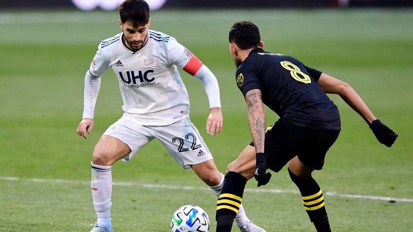 COLUMBUS, OHIO - DECEMBER 06: Carles Gil #22 of New England Revolution controls the ball against Artur #8 of Columbus Crew during the Eastern Conference Final of the MLS Cup Playoffs at MAPFRE Stadium on December 06, 2020 in Columbus, Ohio. Columbus Crew won 1-0.