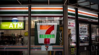 Signage is displayed outside a 7-Eleven store, a subsidiary of Seven & i Holdings Co., in Chicago, Illinois, on Monday, Aug. 3, 2020.