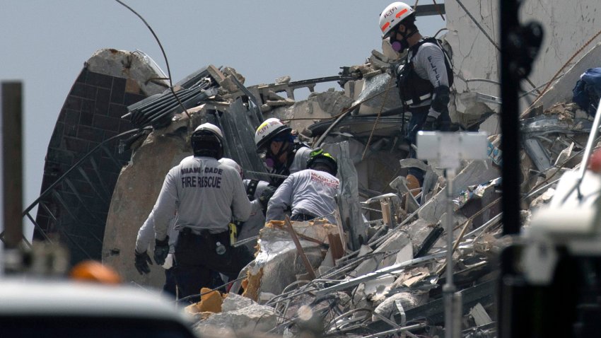 SURFSIDE, FLORIDA – JUNE 25: Miami-Dade Fire Rescue personnel continue search and rescue operations in the partially collapsed 12-story Champlain Towers South condo building on June 25, 2021 in Surfside, Florida. Over one hundred people are being reported as missing as search-and-rescue effort continues with rescue crews from across Miami-Dade and Broward counties. (Photo by Joe Raedle/Getty Images)