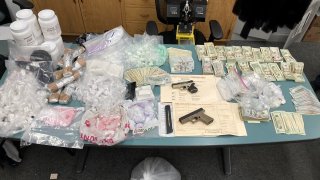 Guns, drugs and cash seized in Oakland.
