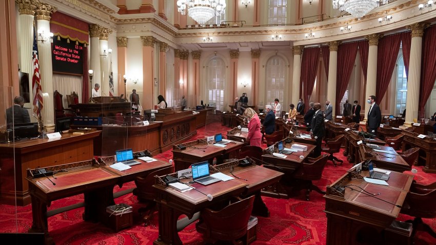 FILE – This Aug. 27, 2020 file photo shows senate chambers at the State Capitol, in Sacramento, Calif. California lawmakers have approved a new state operating budget.The state Legislature sent their spending plan to California Gov. Gavin Newsom on Monday, June 14, 2021. The state Constitution says lawmakers must pass a budget by June 15 or they don’t get paid. Newsom and Democratic leaders agree on most big spending priorities. But they disagree on how much money to spend on ongoing programs. (Paul Kitagaki Jr./The Sacramento Bee via AP, File)