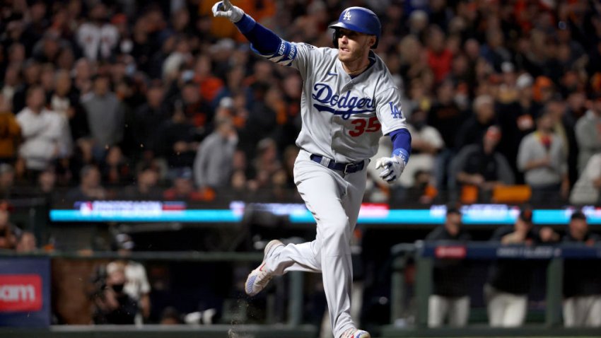 SAN FRANCISCO, CALIFORNIA – OCTOBER 14: Cody Bellinger #35 of the Los Angeles Dodgers celebrates his RBI single to score Justin Turner #10 against the San Francisco Giants during the ninth inning in game 5 of the National League Division Series at Oracle Park on October 14, 2021 in San Francisco, California. (Photo by Harry How/Getty Images)