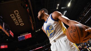 Stephen Curry #30 of the Golden State Warriors looks on during a preseason game.