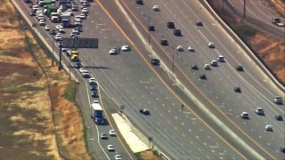 Vehicles are diverted off eastbound Interstate 580 in the Livermore area.