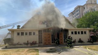 Firefighters battle a blaze at a church in San Jose.