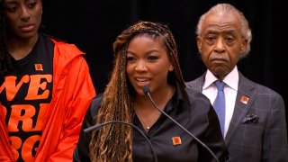 Cherelle Griner stands with Rev Al Sharpton during a press conference on her wife, Brittney Griner.