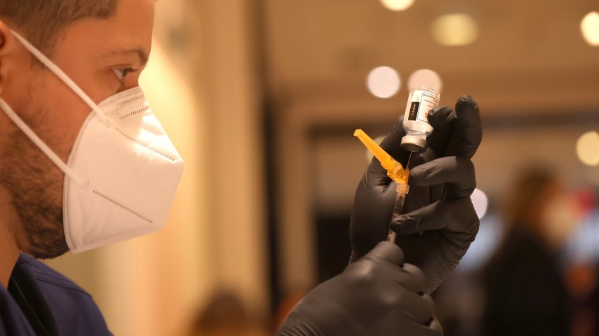 Jatniel Hernandez fills syringes with COID-19 vaccine booster shots at a COVID-19 vaccination clinic on April 06, 2022 in San Rafael, California. The U.S. Food and Drug Administration has authorized a second COVID-19 booster of Pfizer-BioNTech and Moderna vaccines for people over 50 years old four months after their first booster.