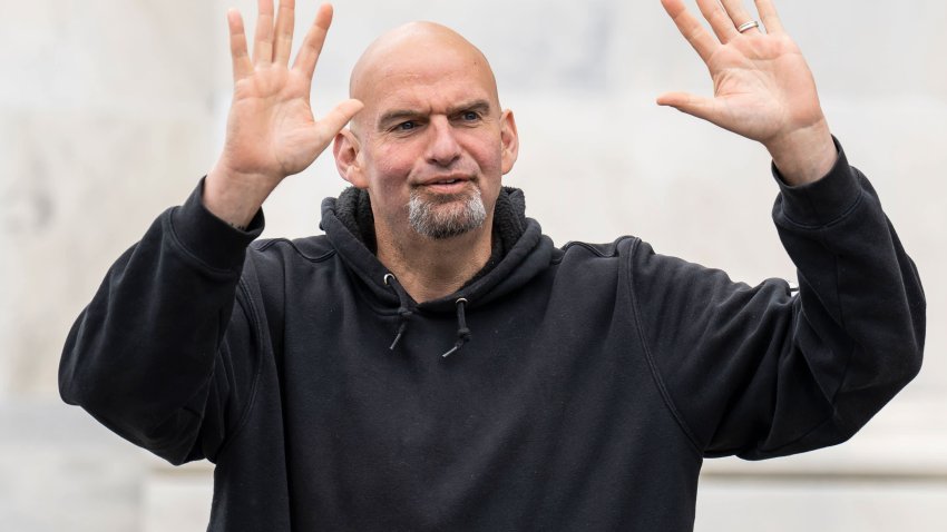 U.S. Sen. John Fetterman (D-PA) waves to reporters as he arrives at the U.S. Capitol on April 17, 2023 in Washington, DC.