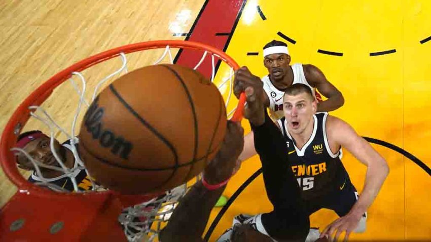 MIAMI, FLORIDA – JUNE 09: Bam Adebayo #13 of the Miami Heat hangs on the rim and is called for offensive basket interference on an attempted dunk during the third quarter against the Denver Nuggets in Game Four of the 2023 NBA Finals at Kaseya Center on June 09, 2023 in Miami, Florida. NOTE TO USER: User expressly acknowledges and agrees that, by downloading and or using this photograph, User is consenting to the terms and conditions of the Getty Images License Agreement. (Photo by Kyle Terada – Pool/Getty Images)