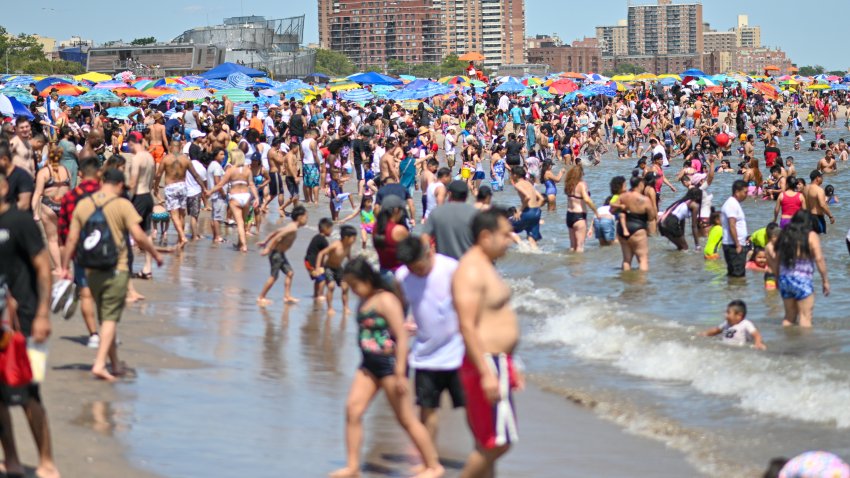 NEW YORK, NEW YORK – JULY 04:  People fill the beach at Coney Island on July 04, 2022 in the Brooklyn borough of New York City. People filled the beaches and boardwalks as temperatures reached above 80 degrees with ‘real-feel’ temperatures above 95 degrees. (Photo by Alexi Rosenfeld/ Getty Images)