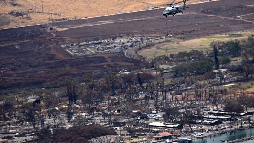 Marine One, carrying US President Joe Biden, flies above wildfire damage in Lahaina on the island of Maui, in Hawaii on August 21, 2023. The Bidens are expected to meet with first responders, survivors, and local officials following deadly wildfires in Maui. (Photo by Mandel NGAN / AFP) (Photo by MANDEL NGAN/AFP via Getty Images)