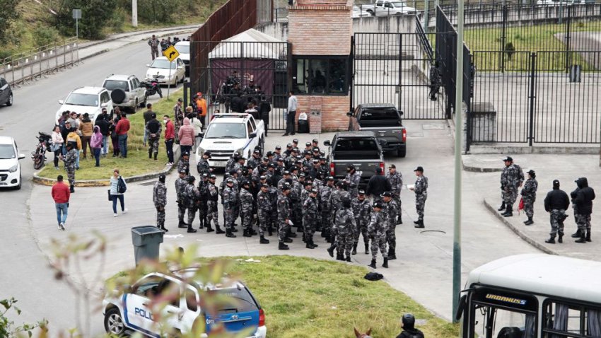 Police officers gather outside the Turi prison in Cuenca, Ecuador on September 1, 2023. Almost 60 prison guards and police officers were being held hostage Friday by inmates across Ecuador. Ecuador’s SNAI prisons authority announced Thursday night that 50 prison guards and seven police officers were being held in six different prisons, without giving further details. The news came after two car bombs were detonated near buildings belonging to the prisons authority in Quito the previous evening, with no-one injured. Three grenade explosions also shook the capital. (Photo by Fernando MACHADO / AFP) (Photo by FERNANDO MACHADO/AFP via Getty Images)