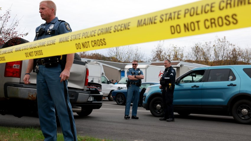 LEWISTON, MAINE – OCTOBER 29: Law enforcement personnel stand outside of  Schemengees Bar, where one of two mass shootings took place on October 29, 2023 in Lewiston, Maine. Mr. Card, who allegedly killed 18 people in a mass shooting at a bowling alley and restaurant in Lewiston was found dead in nearby Lisbon. (Photo by Joe Raedle/Getty Images)