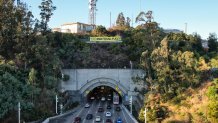 A 75-foot banner was hung over the Bay Bridge Tunnel by protesters ahead of San Francisco's meeting of APEC leaders, Nov. 8, 2023. (Oil and Gas Action Network via BCN)