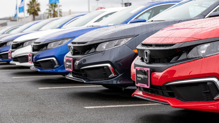 Row of Honda cars in dealership lot