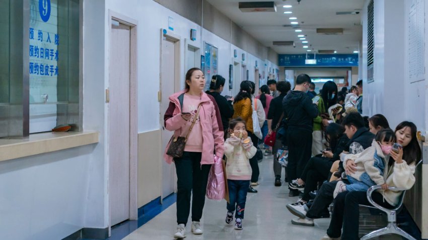 Parents with children who are suffering from respiratory diseases are lining up at a children’s hospital in Chongqing, China, on November 23, 2023. (Photo by Costfoto/NurPhoto via Getty Images)