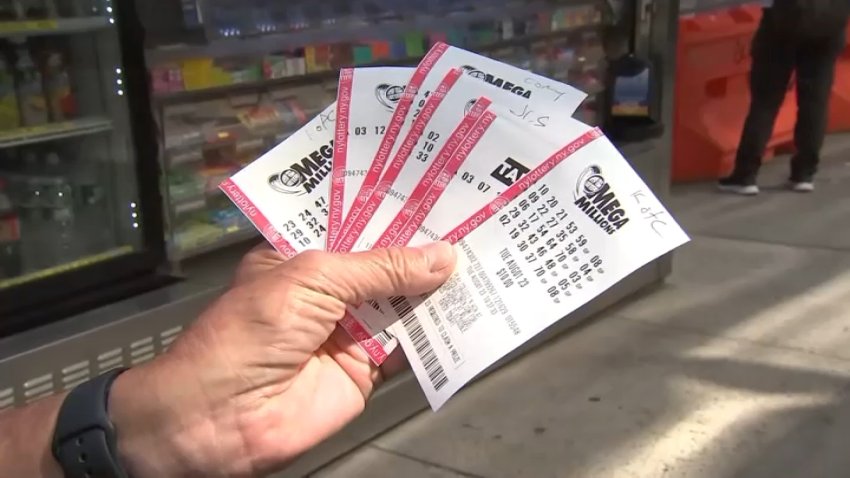 An image of a handful of Mega Millions lottery tickets.