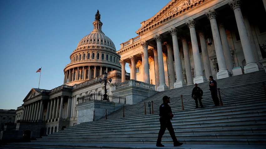 FILE - U.S. Capitol Police stand watch on the East Front at sunrise on Oct. 25, 2023, in Washington, D.C.