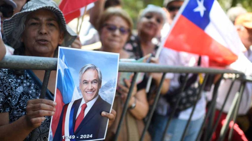 Supporters of former Chilean President Sebastian Piñera gather outside the National Congress in Santiago on February 7, 2024. Three days of mourning and funeral ceremonies got underway Wednesday for Chile’s ex-president Sebastian Pinera, who died a day earlier when the helicopter he was piloting crashed into a lake. (Photo by Pablo Vera / AFP) (Photo by PABLO VERA/AFP via Getty Images)