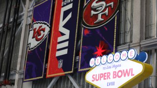 A Kansas City Chiefs and San Francisco 49ers banner is displayed for Super Bowl LVIII.