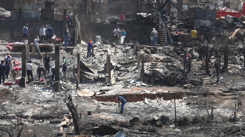 VINA DEL MAR, CHILE – FEBRUARY 05: A general view of the houses destroyed in forest fires as hundreds of people begin to remove debris from thousands of damaged homes in Vina del Mar, affected by forest fires, Chile on February 05, 2024. According to authorities, more than 15,000 homes were destroyed and 122 people died in the fire. (Photo by Lucas Aguayo Araos/Anadolu via Getty Images)