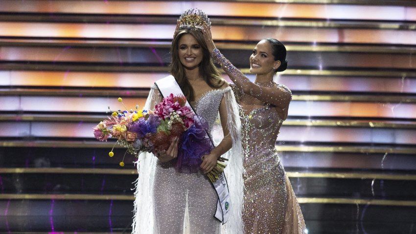 Mia Le Roux (L) is crowned by 2023 Miss South Africa Natasha Joubert (R) on stage at the 2024 Miss South Africa final at SunBet Arena in Pretoria on August 10, 2024. The South Africa national beauty pageant selects South African representatives to compete in one of the The Big Four or the Big League Pageants, the four major international beauty pageants for women  Miss World, Miss Universe, Miss International and Miss Earth. (Photo by MARCO LONGARI / AFP) (Photo by MARCO LONGARI/AFP via Getty Images)