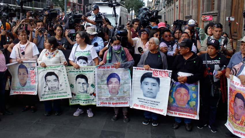 MEXICO CITY, MEXICO – JULY 29: Parents of the 43 missing Ayotzinapa students hold pictures of their sons during their arrival prior to a private meeting with President-elect Claudia Sheinabaum on July 29, 2024 in Mexico City, Mexico. (Photo by Brigette Reyes/ObturadorMX/Getty Images)