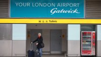 LONDON, ENGLAND – MARCH 27: A traveller stands with her luggage at Gatwick Airport on March 27, 2022 in London, England. Gatwick’s South terminal closed in June 2020 to reduce costs during the Coronvirus pandemic when traveller numbers reduced significantly. It has undergone months of refurbishment and re-opens today to meet the expected increased demand for air travel over Easter and the coming summer now that restrictions have been lifted. (Photo by Hollie Adams/Getty Images)