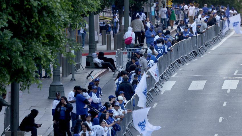 LOS ANGELES, CA – NOVEMBER 1, 2024 – – Fans wait in the early morning hours before the Los Angeles Dodgers celebrate their World Series win traveling in a parade route along 5th Street in downtown Los Angeles on November 1, 2024. (Genaro Molina/Los Angeles Times via Getty Images)