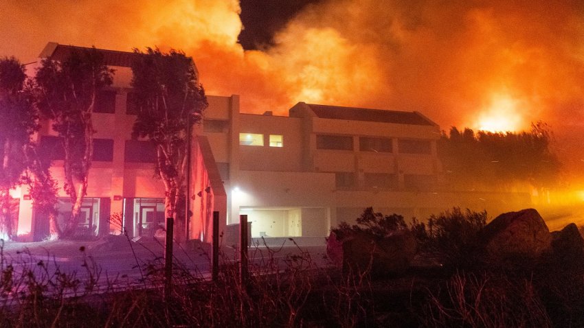 Hillsides burn around Pepperdine University during the Franklin fire in Malibu, California, US, on Tuesday, Dec. 10, 2024. Hundreds of firefighters are racing to control a fast-moving Southern California wildfire that’s threatening the wealthy town of Malibu and has forced the evacuation of thousands of residents. Photographer: Kyle Grillot/Bloomberg via Getty Images