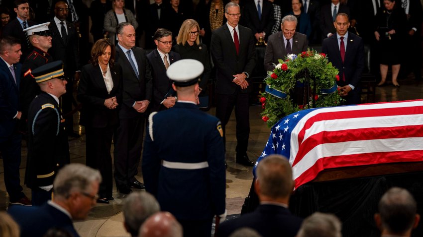 US Vice President Kamala Harris, from left, Second Gentleman Doug Emhoff, US House Speaker Mike Johnson, a Republican from Louisiana, Senate Majority Leader John Thune, a Republican from South Dakota, Senate Minority Leader Chuck Schumer, a Democrat from New York, and Representative Hakeem Jeffries, a Democrat from New York, attend a ceremony for late former US President Jimmy Carter in the Rotunda of the US Capitol in Washington, DC, US, on Tuesday, Jan. 7, 2025. Carter, the former Georgia peanut farmer who as president brokered a historic and lasting peace accord between Israel and Egypt in a single term marred by soaring inflation, an oil shortage and Iran’s holding of American hostages, died December 29 at 100 years of age. Photographer: Kent Nishimura/The New York Times/Bloomberg via Getty Images