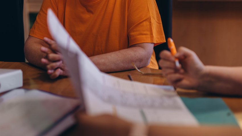 Woman signing document and hand holding pen putting signature at paper, order to authorize their rights. High quality photo