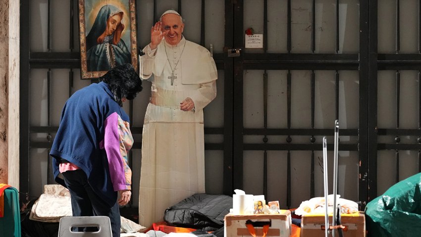 VATICAN CITY, VATICAN – MARCH 09: A cardboard cut-out of pope Francis stands next to the belongings of homeless people in St Peter’s Square on March 09, 2025 in Vatican City, Vatican  Pope Francis was hospitalised in Rome on February 14 with bronchitis, and later developed pneumonia in both his lungs. (Photo by Christopher Furlong/Getty Images)