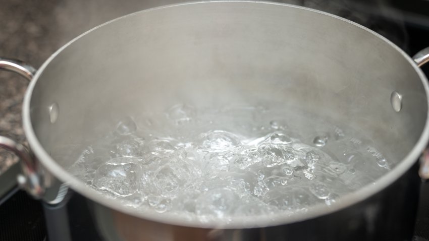 Boiling pot of water, metal pot with water ready for pasta