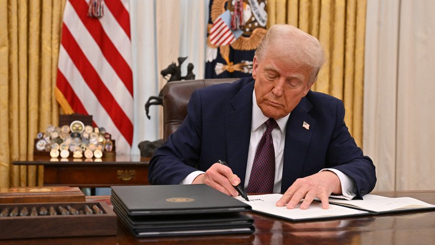 US President Donald Trump signs an executive order to declassify files of former President John F. Kennedy, former Attorney General Robert F. Kennedy and civil rights leader Martin Luther King Jr., in the Oval Office of the White House in Washington, DC, on January 23, 2025. (Photo by ROBERTO SCHMIDT / AFP) (Photo by ROBERTO SCHMIDT/AFP via Getty Images)