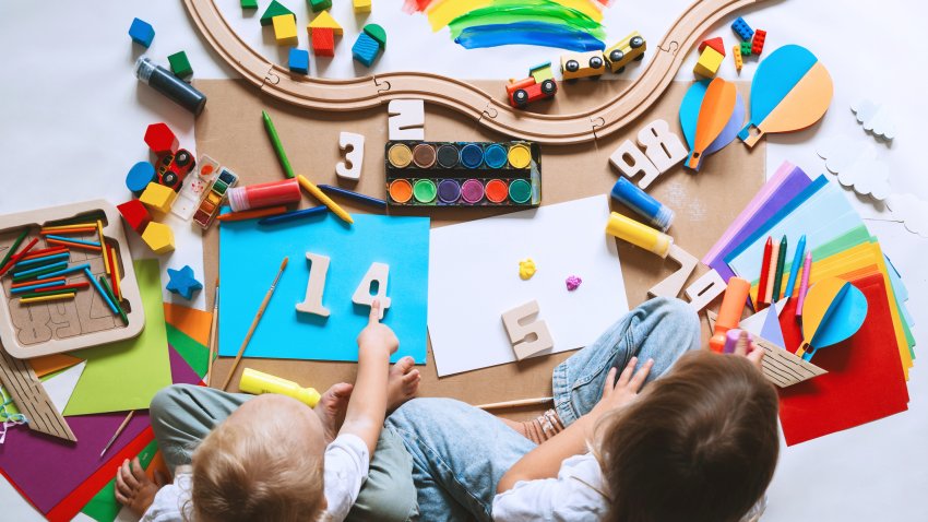 Children drawing and making crafts in kindergarten or daycare. Little kids with educational toys and supplies for creative. hildren education and development in preschool or childcare.