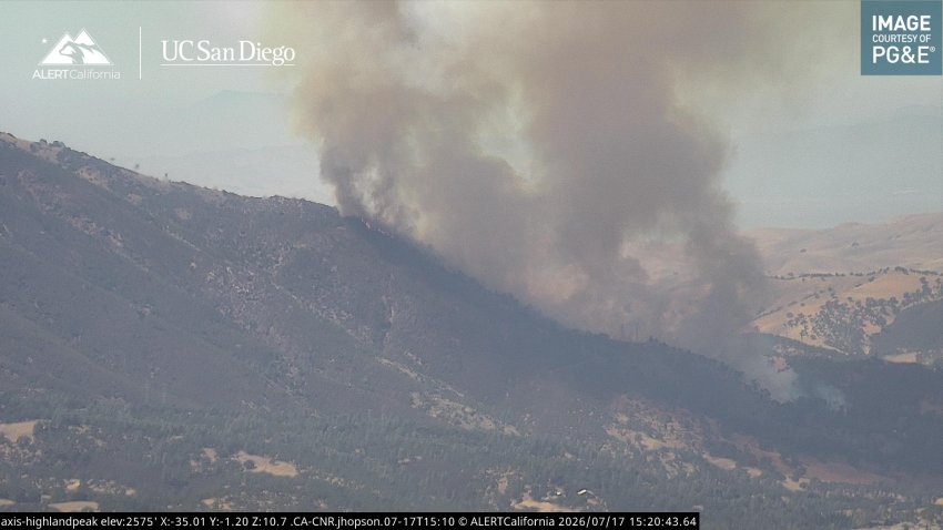 A brush fire burns near Clayton.